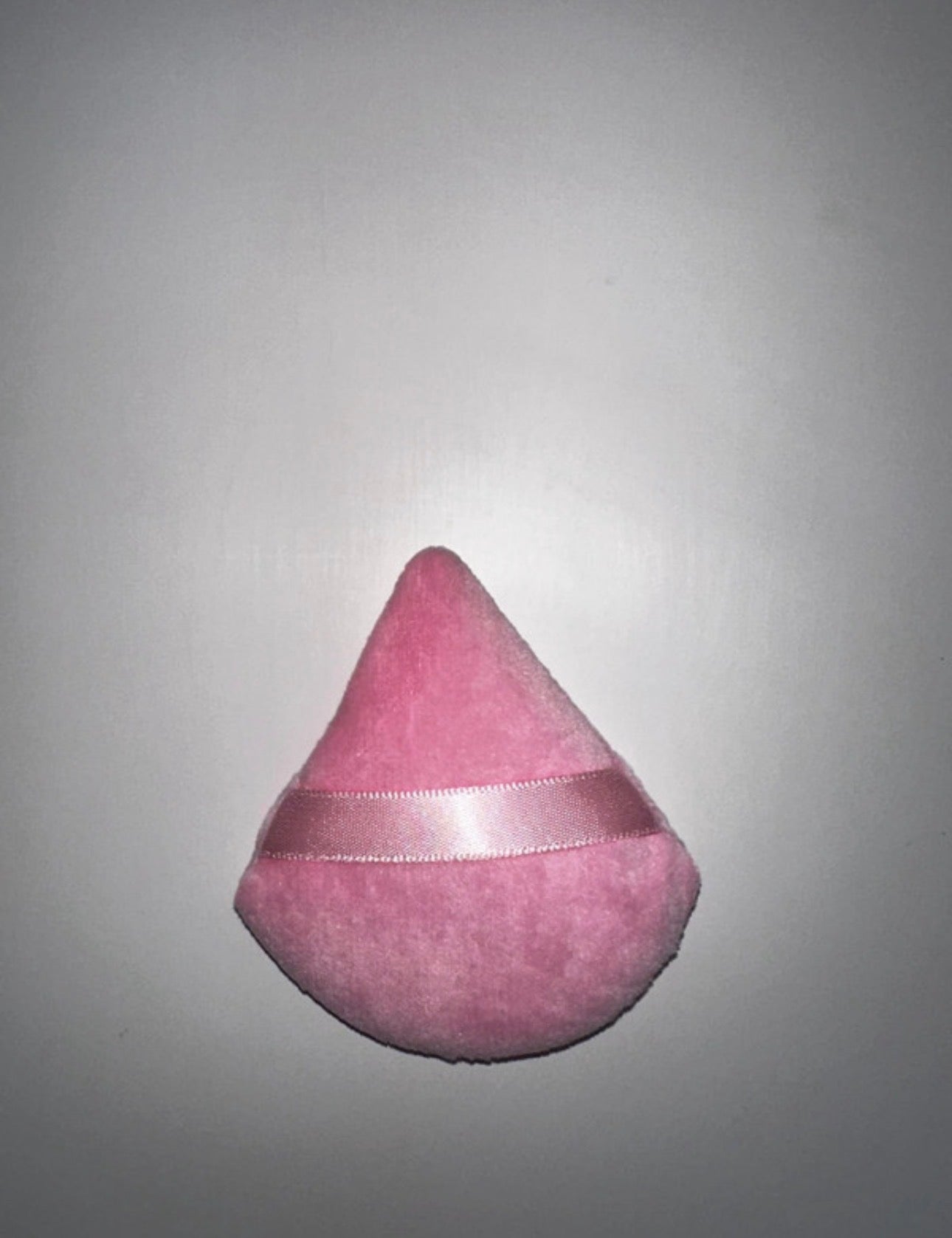 Triangular powder puffs