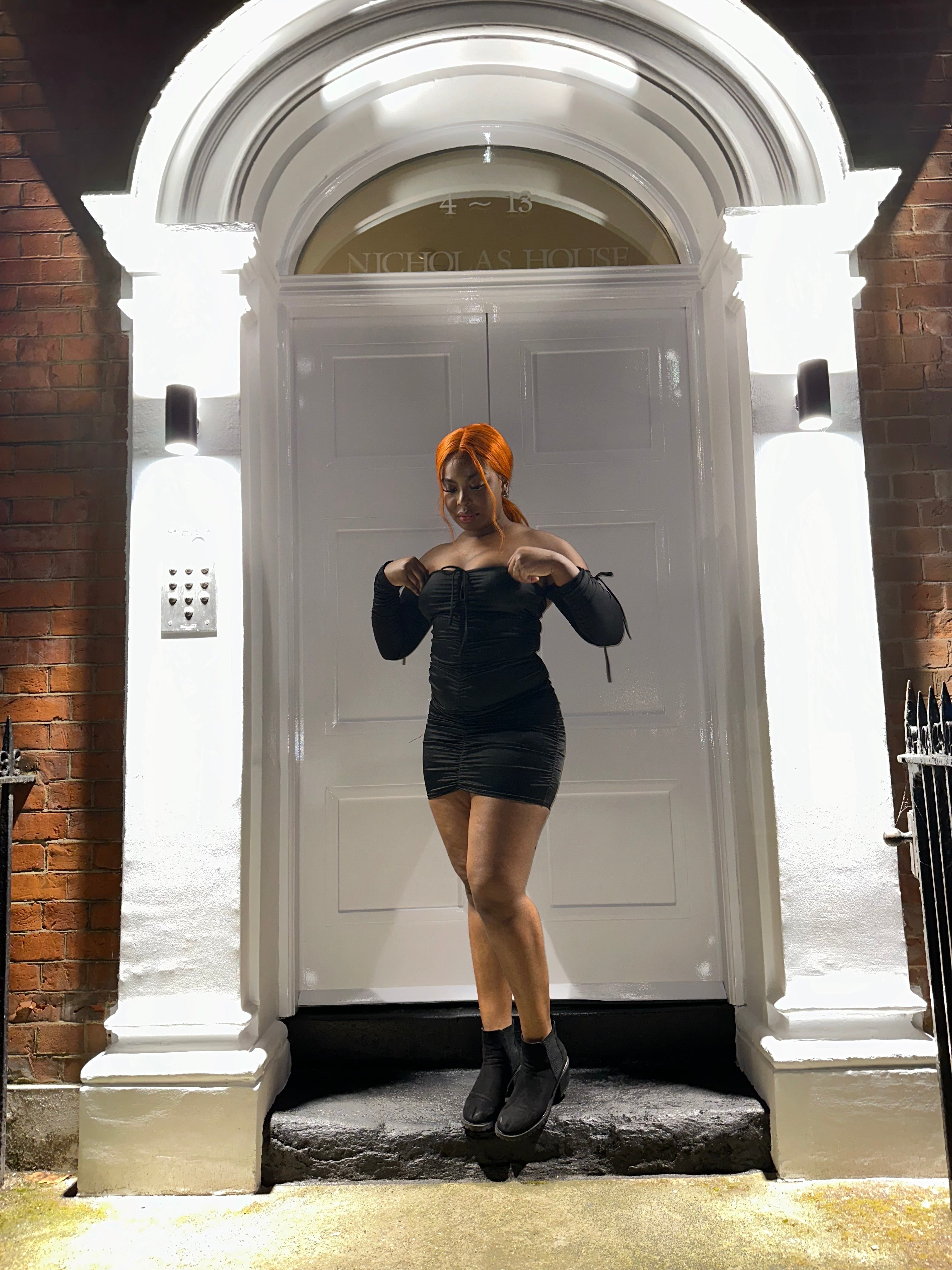 Black Dress In A Satin Ruched Bodycon Style