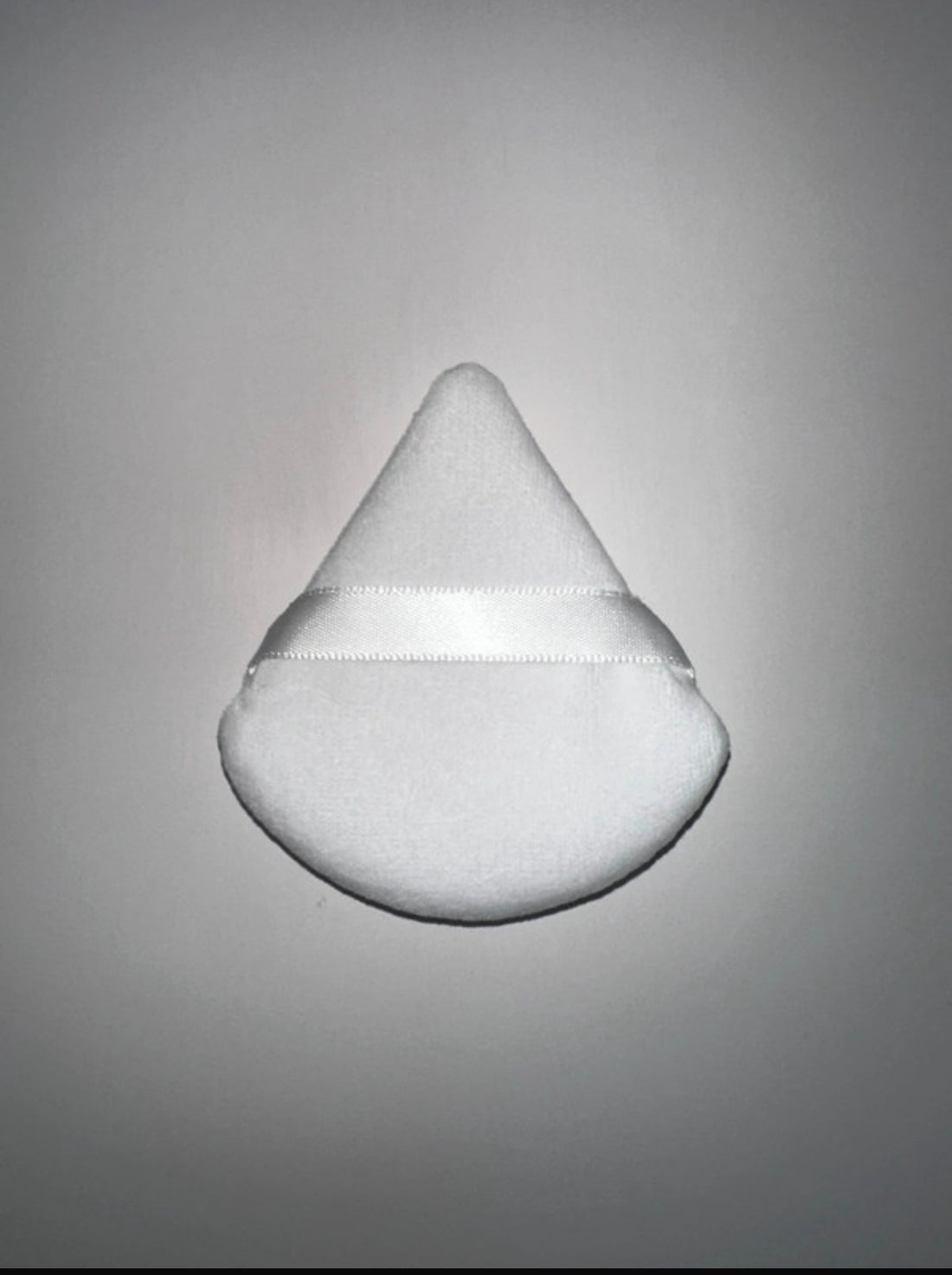 Triangular powder puffs