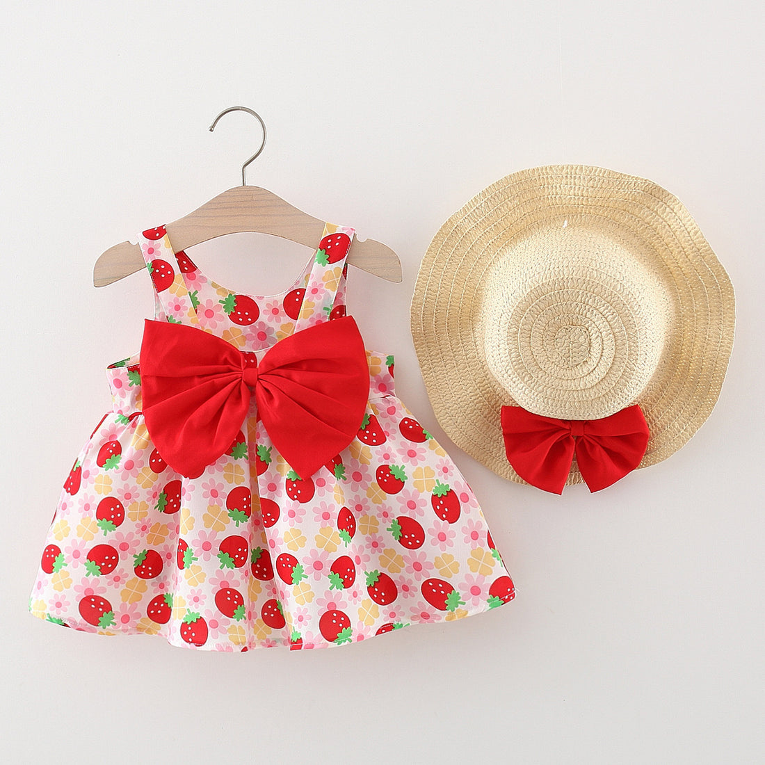 Strawberry dress with straw hat.