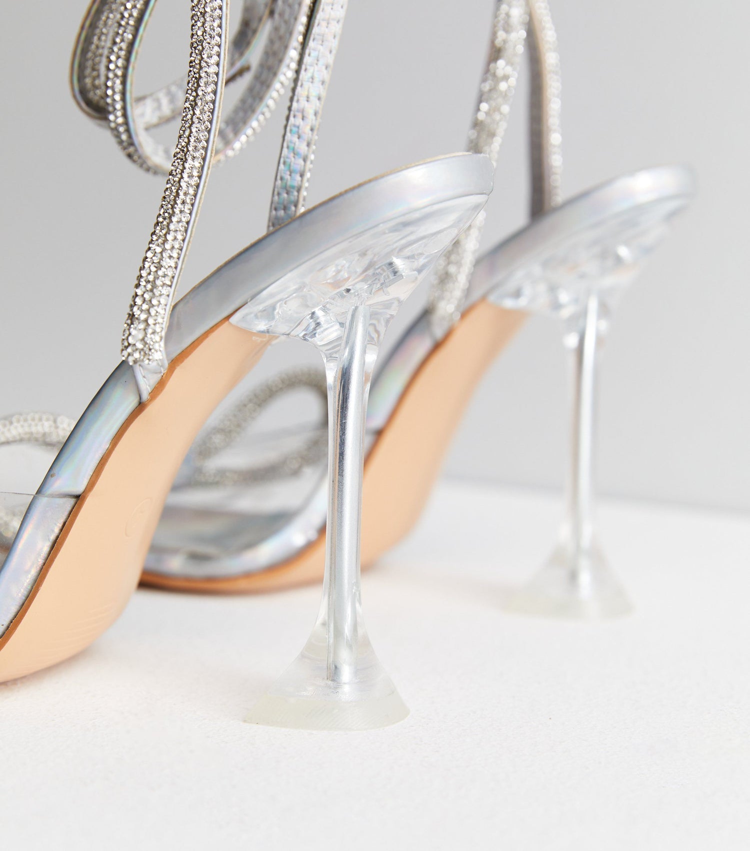 Diamond knot bow metallic heels in gold.