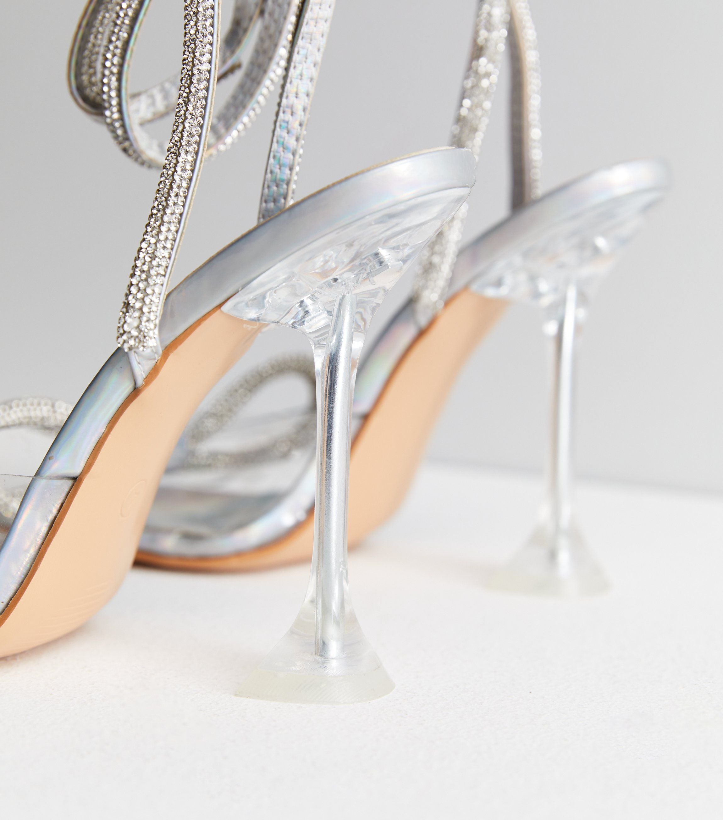 Diamond knot bow metallic heels in gold.