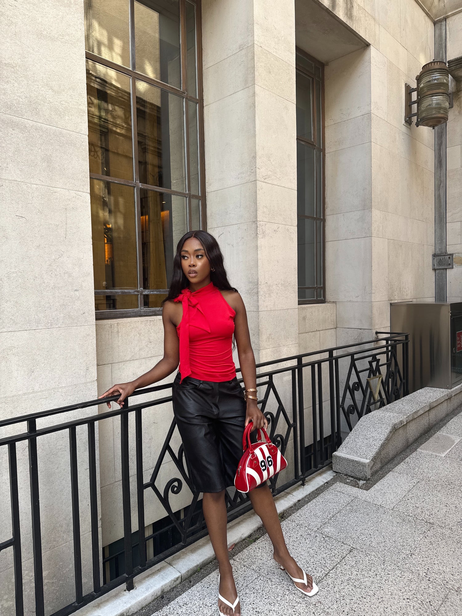 Women’s elegant rouge top with knot.